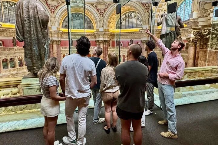 A small group with a guide inside the Library of Congress Great Hall on a Washington DC tour for seniors