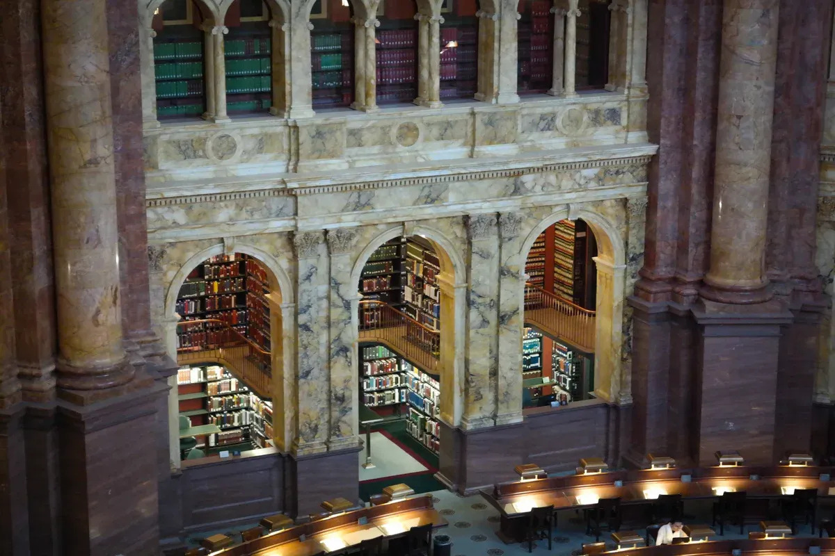 The Main Reading Room of the Library of Congress with its marble arches and book alcoves, a free stop to add to Washington DC tours for seniors